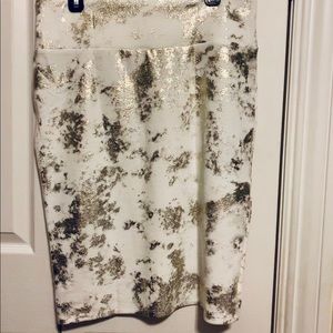 LulaRoe Cassie skirt. Gold flecks and white/cream